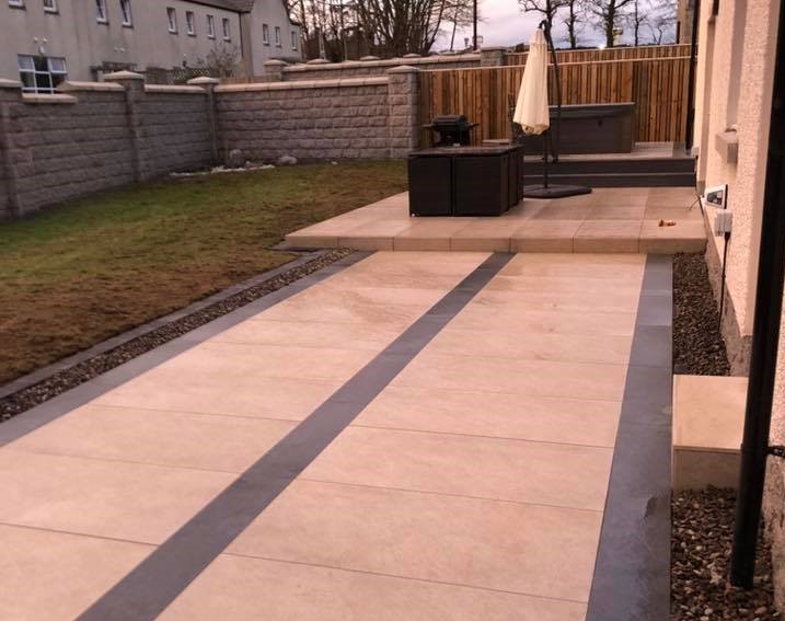 Porcelain patio in cream and grey. Papillon Designs & Landscaping.